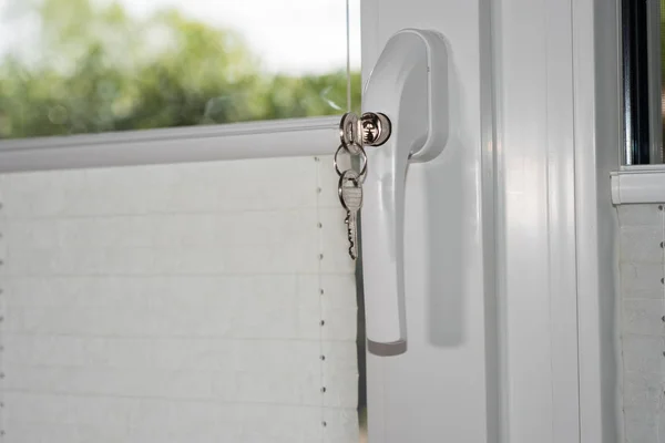 Security technology - lock on door window handle as burglary pro