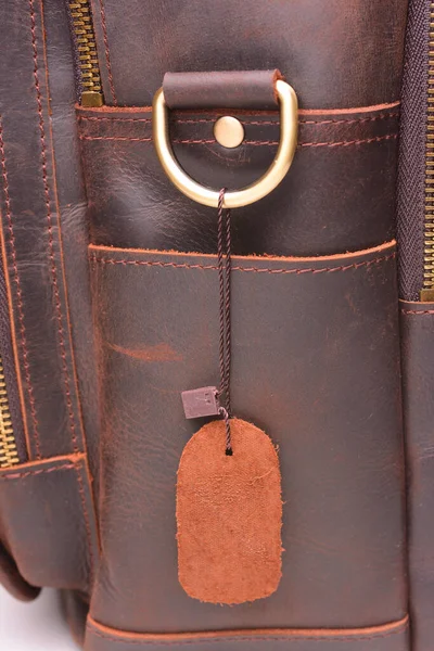 Leather tag on a new bag, close-up