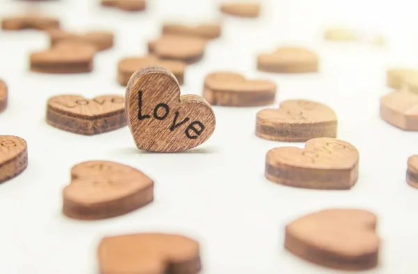 Wooden hearts on a white background. selective focus. — Stock Photo, Image