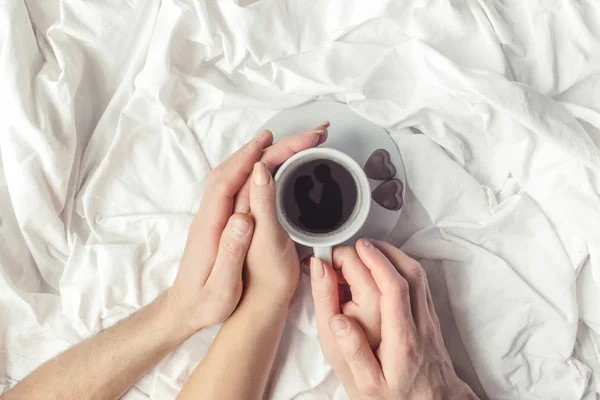 hot coffee in bed. selective focus.