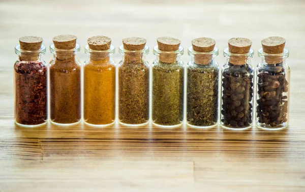 Spices in jars on wooden background. selective focus. — Stock Photo, Image
