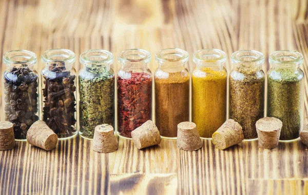 Spices in jars on wooden background. selective focus. — Stock Photo, Image