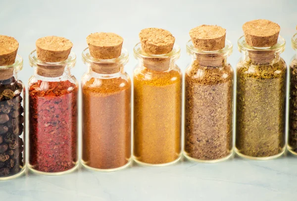 Spices in jars on wooden background. selective focus. — Stock Photo, Image