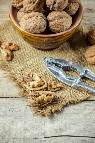 Walnuts on wooden background. Selective focus. — Stock Photo, Image