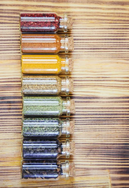 Spices in jars on wooden background. selective focus. — Stock Photo, Image