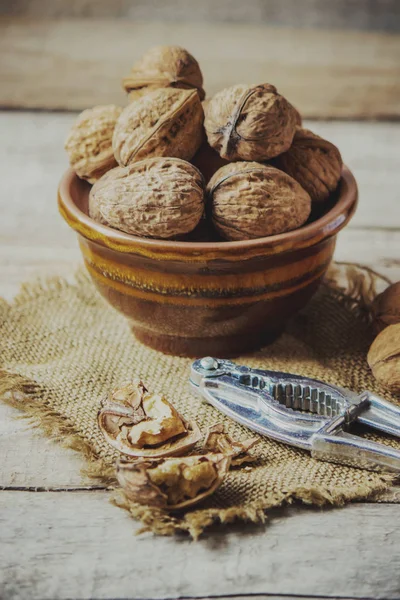 Walnuts on wooden background. Selective focus. — Stock Photo, Image