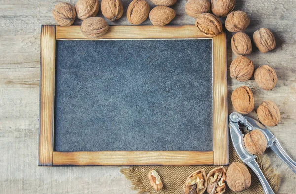 Walnuts on wooden background. Selective focus. — Stock Photo, Image