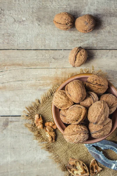 Walnuts on wooden background. Selective focus. — Stock Photo, Image