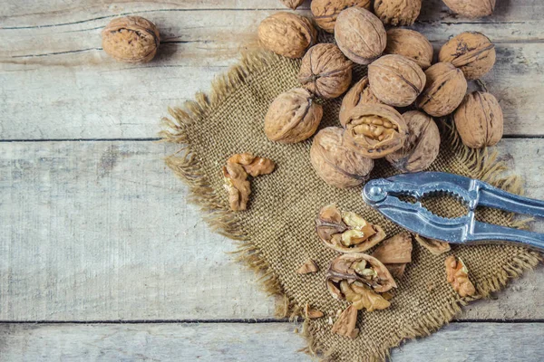 Walnuts on wooden background. Selective focus. — Stock Photo, Image