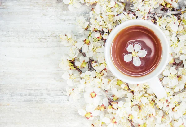 Spring background, flowers and tea. Selective focus.