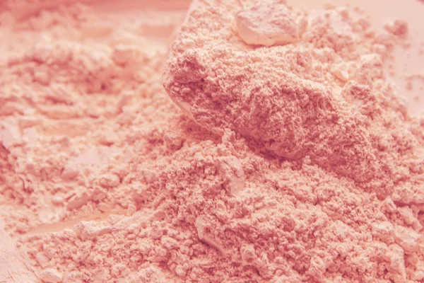 pink clay dry powder cosmetic texture.