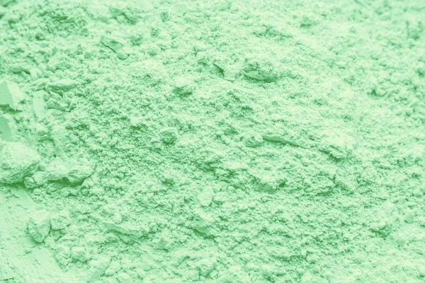 green clay dry powder cosmetic texture.
