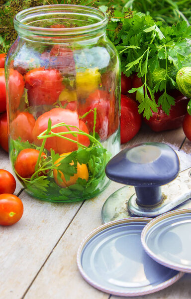 Preservation, pickling vegetables of tomatoes and cucumbers. Selective focus. 