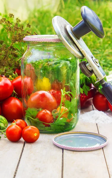 Preservation, pickling vegetables of tomatoes and cucumbers. Selective focus. — Stock Photo, Image