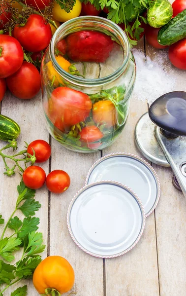 Preservation, pickling vegetables of tomatoes and cucumbers. Selective focus. — Stock Photo, Image