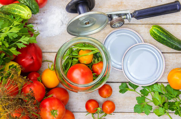 Preservation, pickling vegetables of tomatoes and cucumbers. Selective focus. 