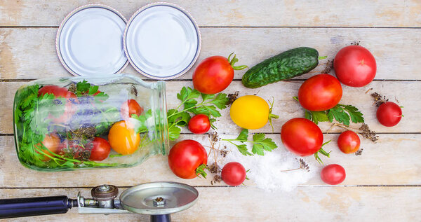 Preservation, pickling vegetables of tomatoes and cucumbers. Selective focus. 