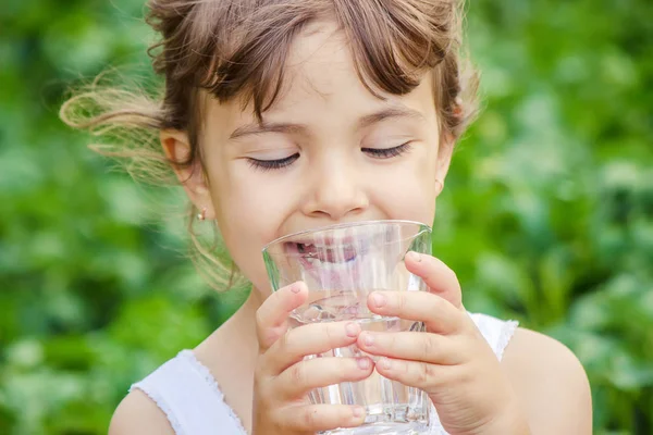 Child drinks water. Stock Photo