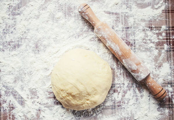 Yeast dough on the table. Cooking baking. Selective focus. 