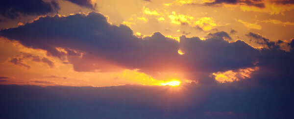The clouds in the sky and the rays of the sun. sunset, selective focus.