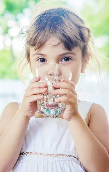 Child drinks water. Stock Image