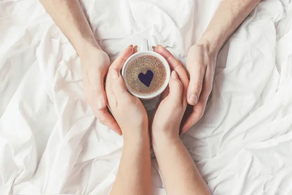 Coffee in bed. Selective focus.