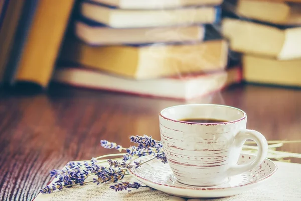 A cup of coffee and a book. Leisure. Selective focus.