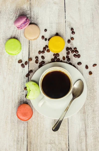 Macaroons and coffee. Breakfast. Selective focus.