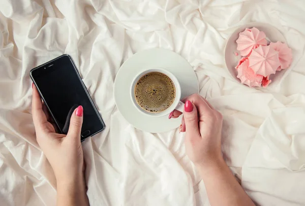 Coffee in bed. Selective focus.