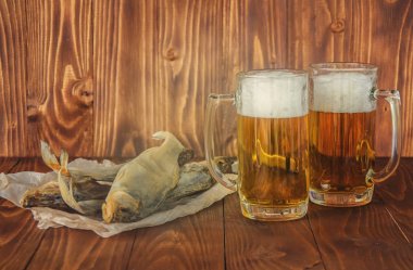 dried fish and beer. selective focus.  clipart