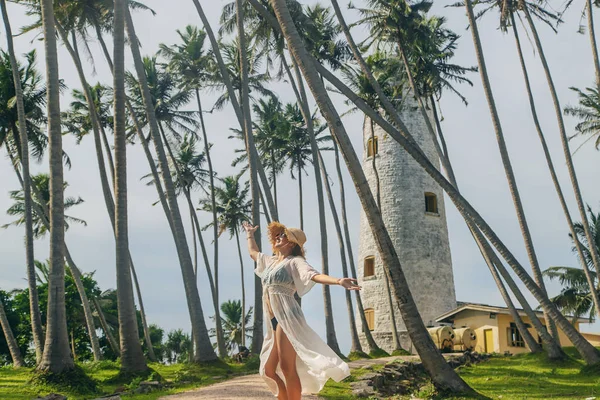 Girl in Sri Lanka on an island with a lighthouse. Selective focus. — Stock Photo, Image
