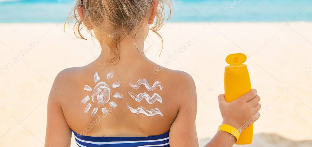 Sunscreen on the skin of a child. Selective focus. nature.