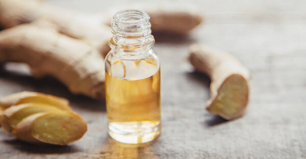 Ginger essential oil in a small bottle. Selective focus. nature.