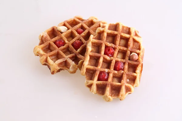 Sweet Belgian waffle with dried cranberries and nuts — Stock Photo, Image