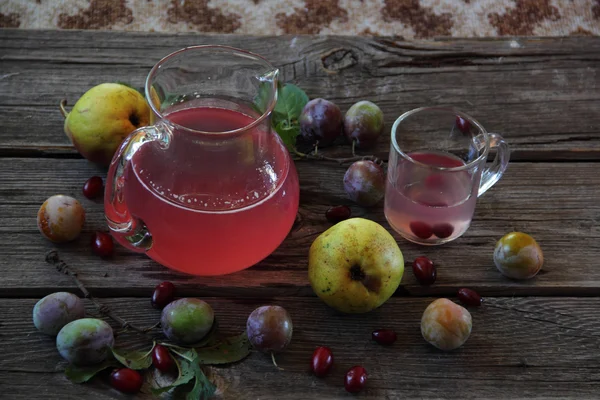 Still life with compote of fresh plums and pears — Stock Photo, Image