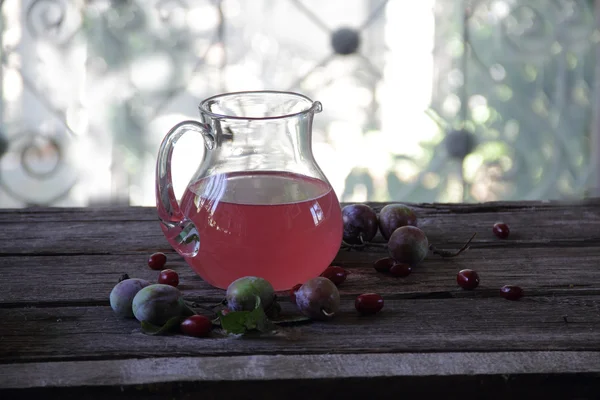 Still life with compote of fresh plums and pears — Stock Photo, Image