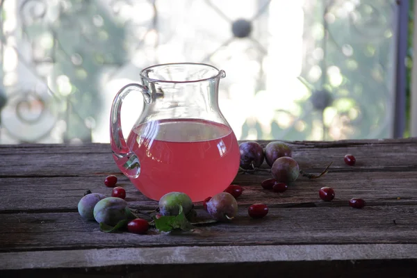 Still life with compote of fresh plums and pears — Stock Photo, Image