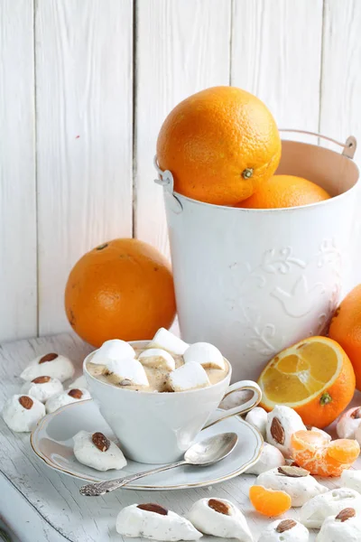 Coffee cappuccino with meringue and oranges — Stock Photo, Image