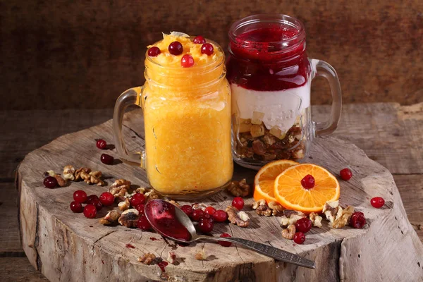 Smoothies in a transparent glass with yogurt and nuts — Stock Photo, Image