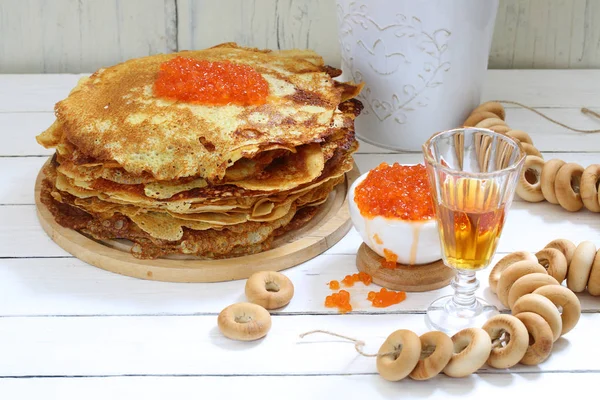 Pancakes with red caviar and tincture in the glass — Stock Photo, Image