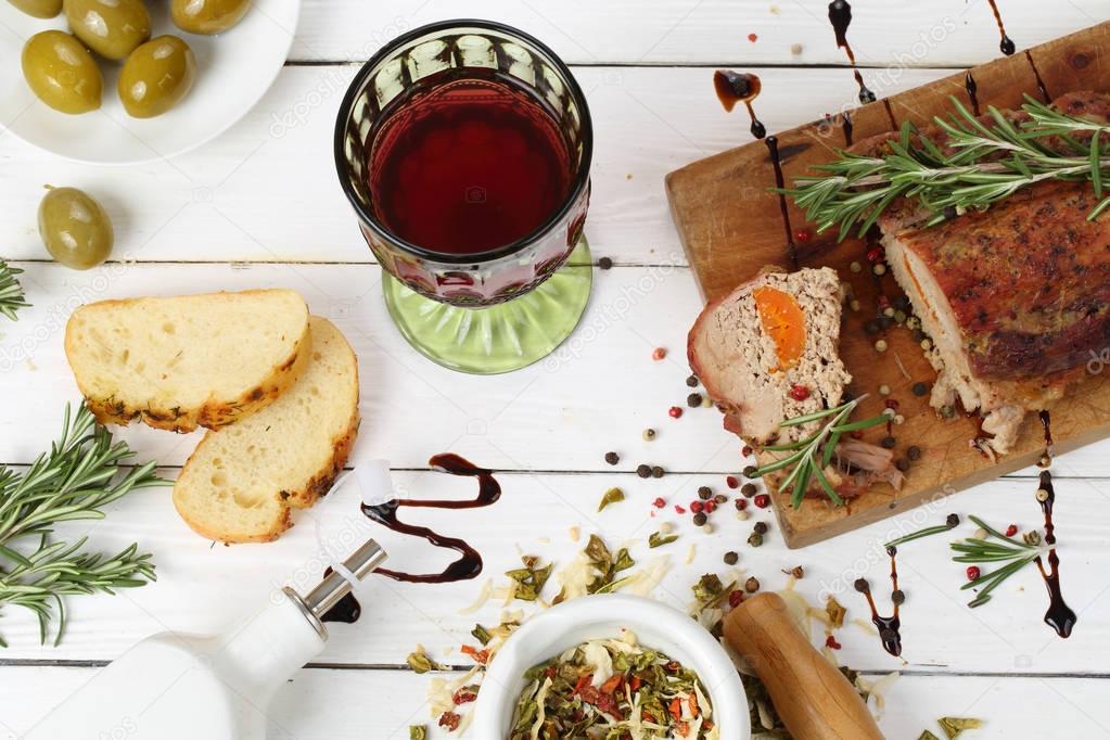 Baked ham with red wine on wooden background