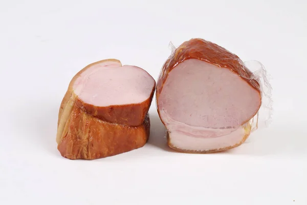 Ham gerookt in verpakking op witte achtergrond — Stockfoto