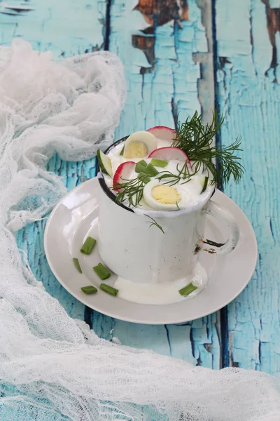 Okroshka on kefir on a blue wooden background — Stock Photo, Image