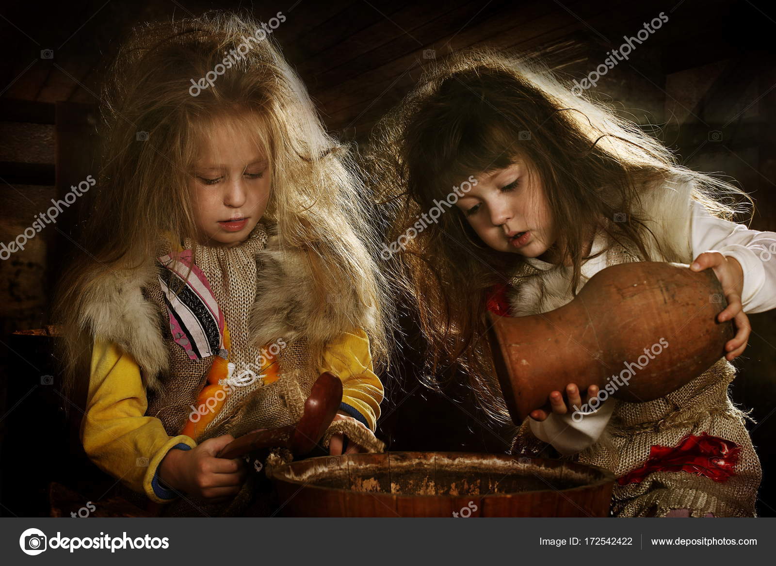 Two girls dress up as fairytale characters, fairytale character grandma  ezhka, girls play Stock Photo by ©DmZo 172542422