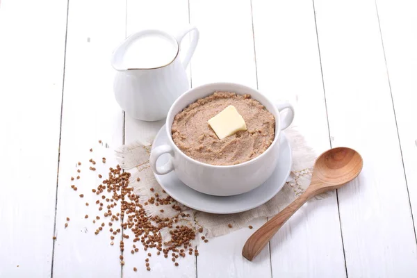 Porridge with milk on a white background — Stock Photo, Image