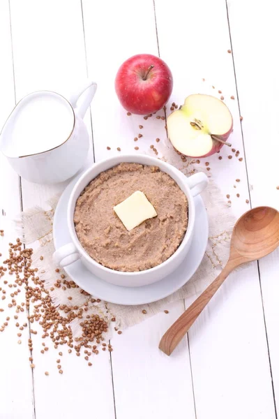 Porridge with milk on a white background — Stock Photo, Image