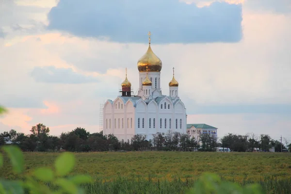 Church with golden domes. Orthodox church with golden domes