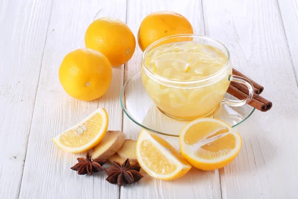 Lemon with cinnamon and anise on a white background. Lemon smoothie
