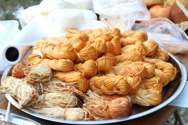 Smoked cheese on the counter. Street cheese trade.