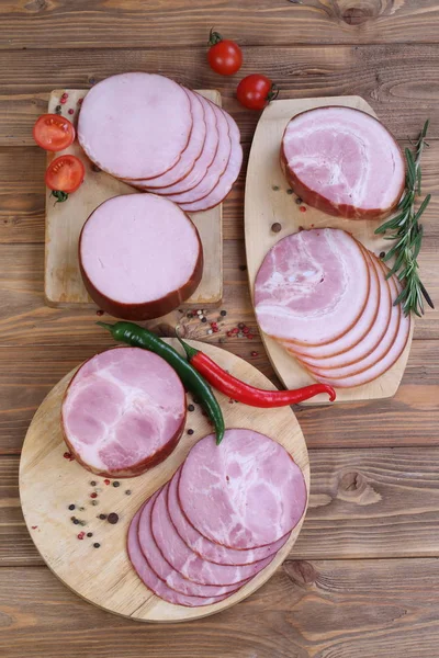 Ham. Pork ham on a wooden background